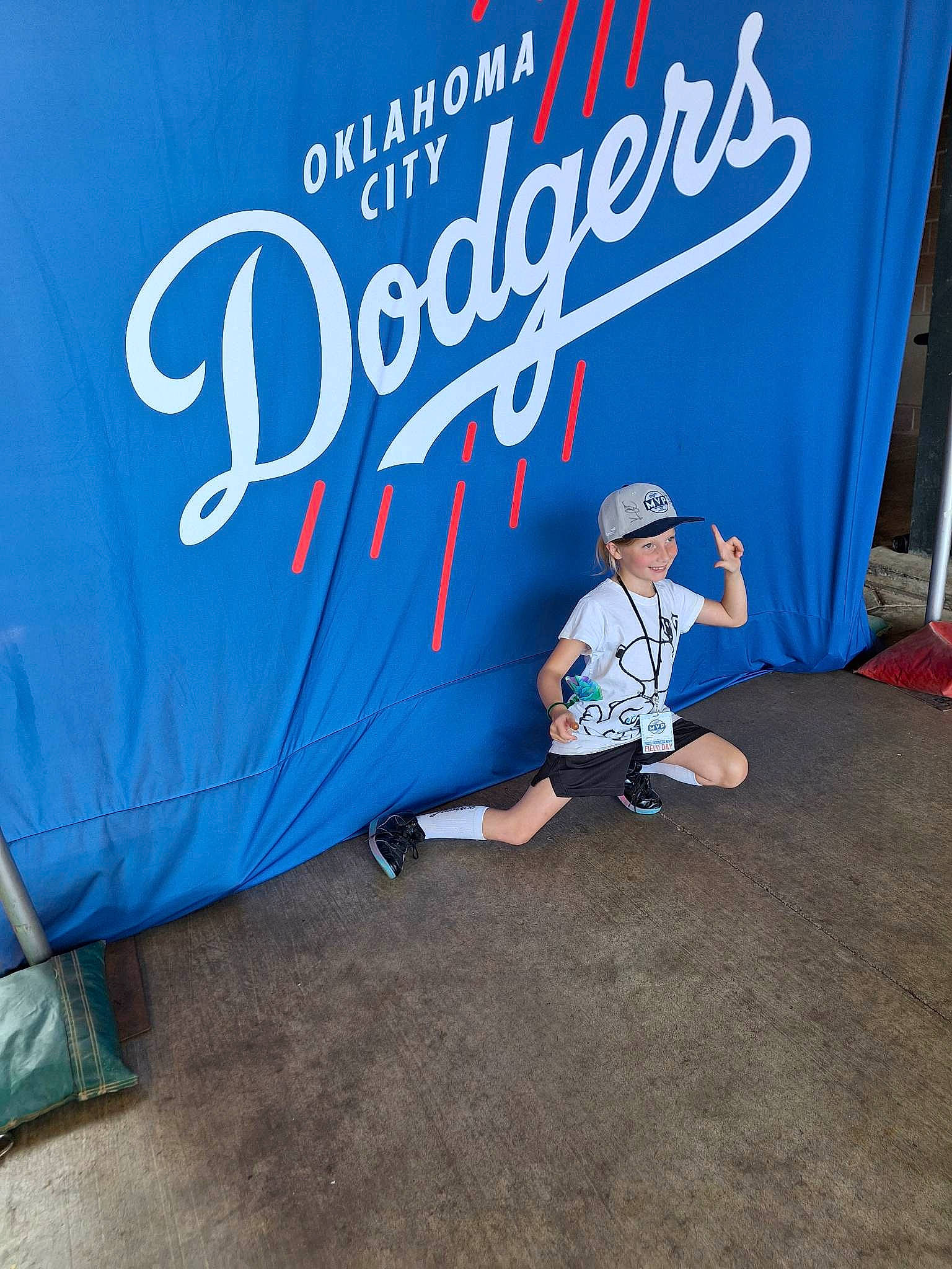 Alice joined the competition — help win amazing prizes! advertising, banner, brand, electric_blue, flooring, font, fun, graphics, grass, hat, headwear, joy, landscape, leisure, logo, person, recreation, signage, sleeve, t_shirt