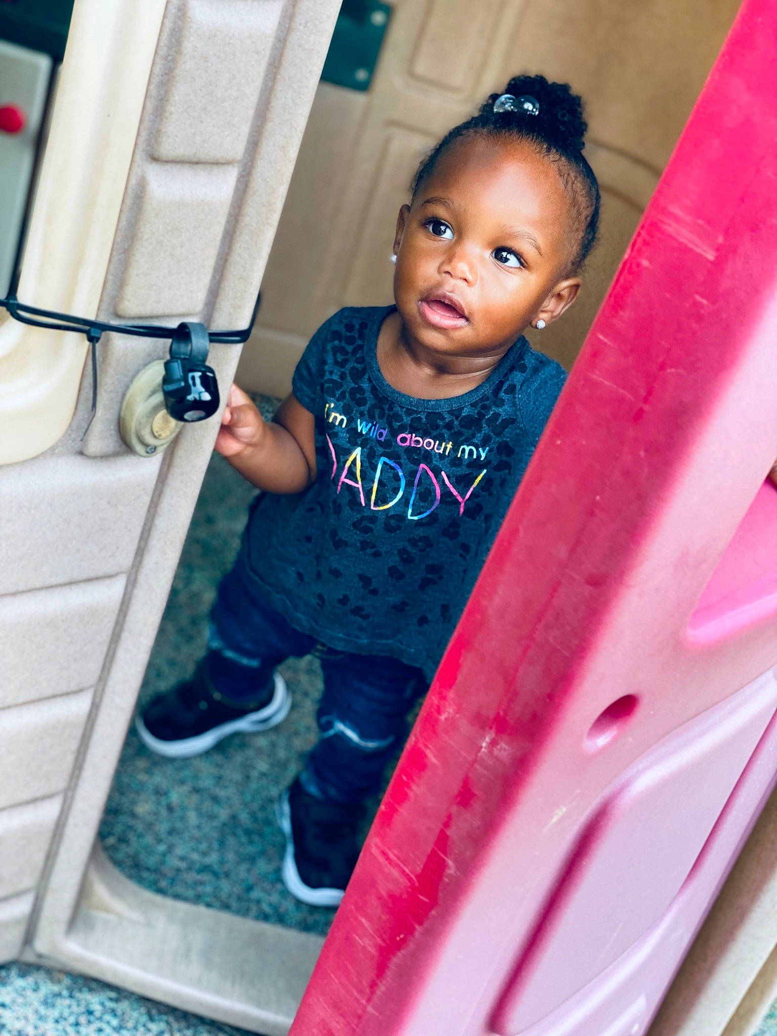 Serenity is registered to the contest to win money with this photo: automotive_exterior, blue, child, dress, electric_blue, face, fun, happy, leisure, magenta, outdoor_play_equipment, person, play, playground_slide, plumbing_fixture, room, shorts, skin, t_shirt, toddler