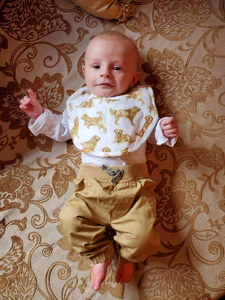 Lake is registered to the contest to win money with this photo: baby, baby_products, baby_toddler_clothing, beige, cheek, child, finger, hand, mammal, mouth, nightwear, nose, pajamas, pattern, peach, person, pink, skin, sleeve, toddler