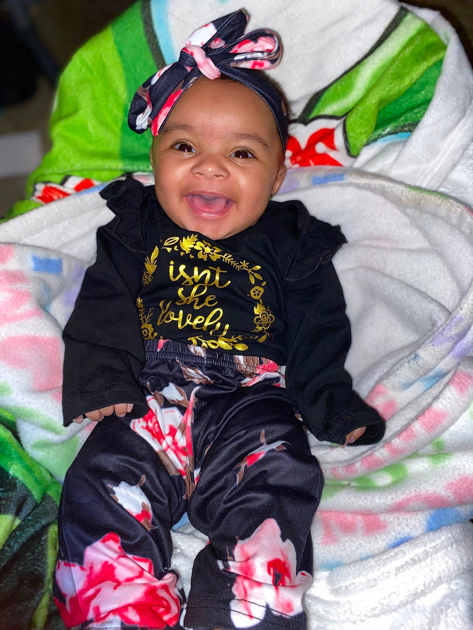 Skye joined the competition — help win amazing prizes! baby, baby_toddler_clothing, carmine, child, costume_hat, event, fun, grass, happy, holiday, magenta, pattern, person, red, sitting, sleeve, smile, textile, toddler, tree