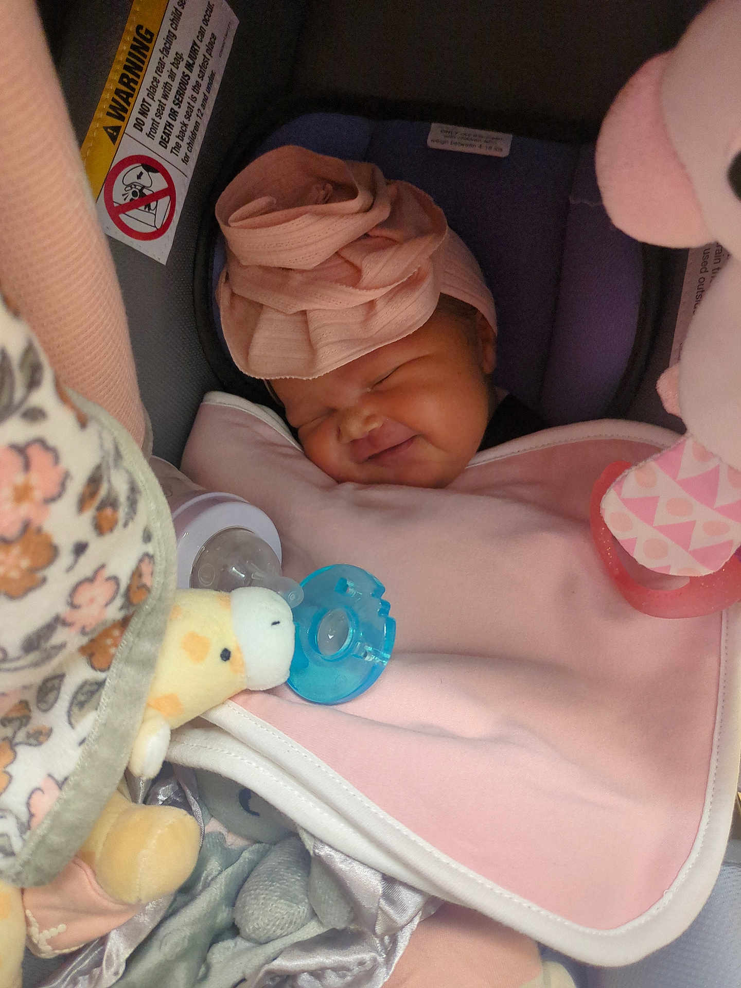 Kinsley joined the competition — help win amazing prizes! baby, sleeping, car_seat, pink, blanket, head_wrap, pacifier, plush_toy, soft_toys, infant, cozy, cute, child, face, smile, resting, indoors, comfort, newborn, peaceful