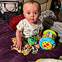 Kingston is registered to the contest to win money with this photo: accessories, architecture, baby, bag, building, clothing, couch, cushion, face, furniture, handbag, head, homedecor, indoors, livingroom, person, photography, portrait, sitting, t_shirt