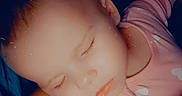 Arianna is registered to the contest to win money with this photo: arm, baby, bedtime, blanket, child, closeup, cozy, cute, eyelashes, face, indoors, infant, peaceful, person, pink_sleeper, rest, skin, sleeping, soft_light, toddler