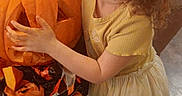 Autumn is registered to the contest to win money with this photo: bodypart, child, clothing, costume, dress, face, female, festival, food, girl, halloween, head, person, photography, plant, portrait, produce, pumpkin, squash, vegetable