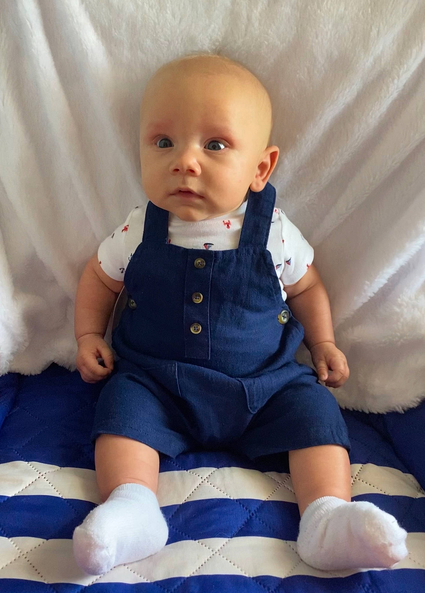 Koah joined the competition — help win amazing prizes! baby, baby_products, baby_toddler_clothing, cheek, child, comfort, electric_blue, finger, human_body, human_leg, knee, linens, pattern, person, sitting, skin, sleeve, sock, t_shirt, toddler