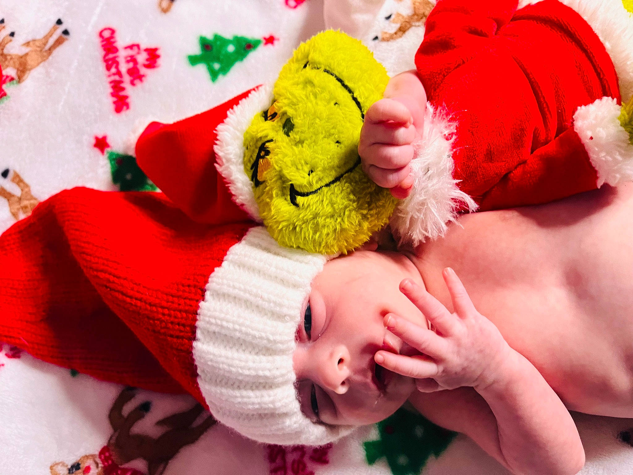 Rosalina is registered to the contest to win money with this photo: arm, baby, baby_sleeping, baby_toddler_clothing, child, comfort, finger, gesture, green, hand, happy, interaction, nail, person, pink, red, skin, stuffed_toy, textile, thumb