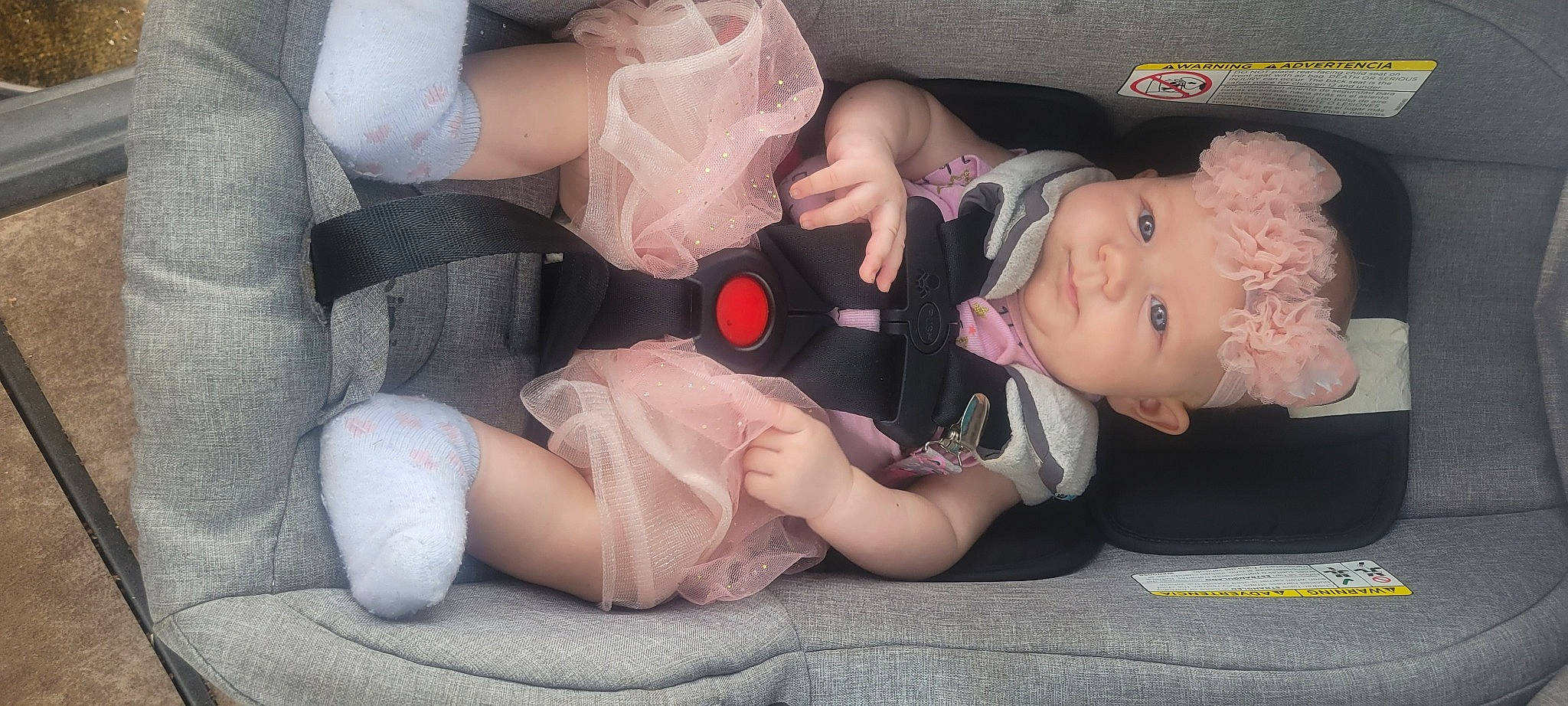 Dakoda is registered to the contest to win money with this photo: arm, baby, comfort, dress, eye, eyelash, facial_expression, fashion, finger, hand, headwear, human_body, leg, mammal, mouth, muscle, person, pink, product, skin