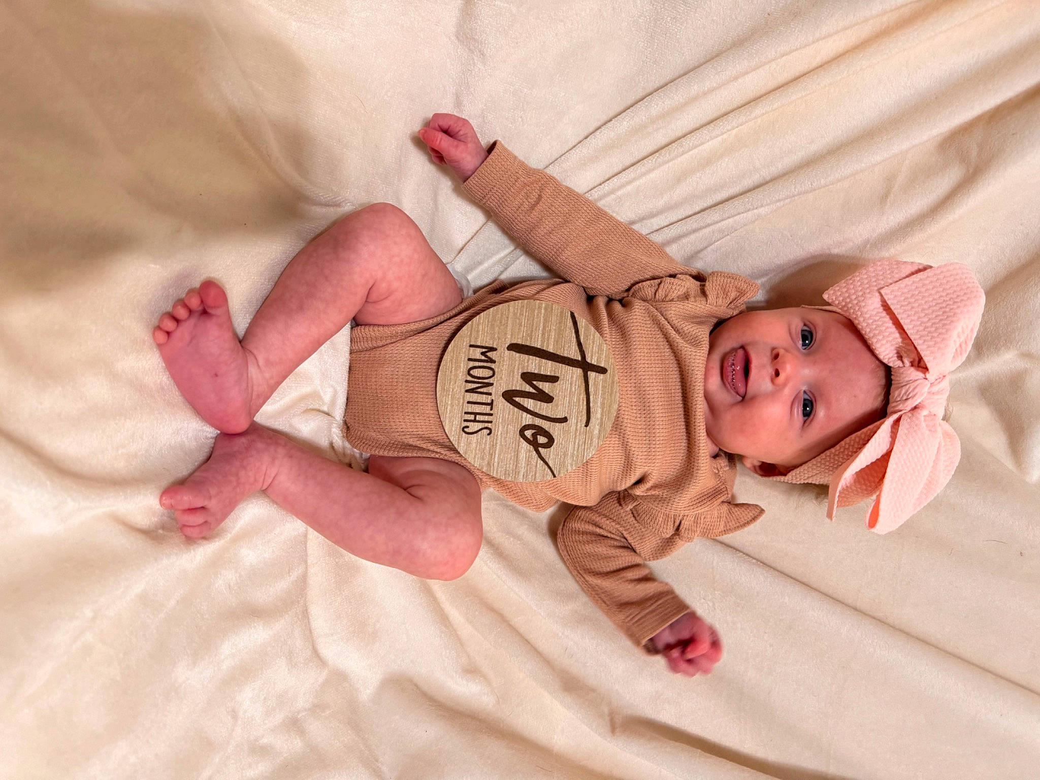 Oaklee is registered to the contest to win money with this photo: arm, baby, baby_sleeping, baby_toddler_clothing, child, comfort, eye, finger, glasses, hand, headwear, human_body, knee, leg, linens, person, pink, skin, sleeve, textile