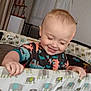 Axel joined the competition — help win amazing prizes! toddler, child, smiling, playpen, elephant_pattern, onesie, indoor, happy, baby, furniture, hand, face, curtains, home, cozy, sleepy, cute, person, infant, play
