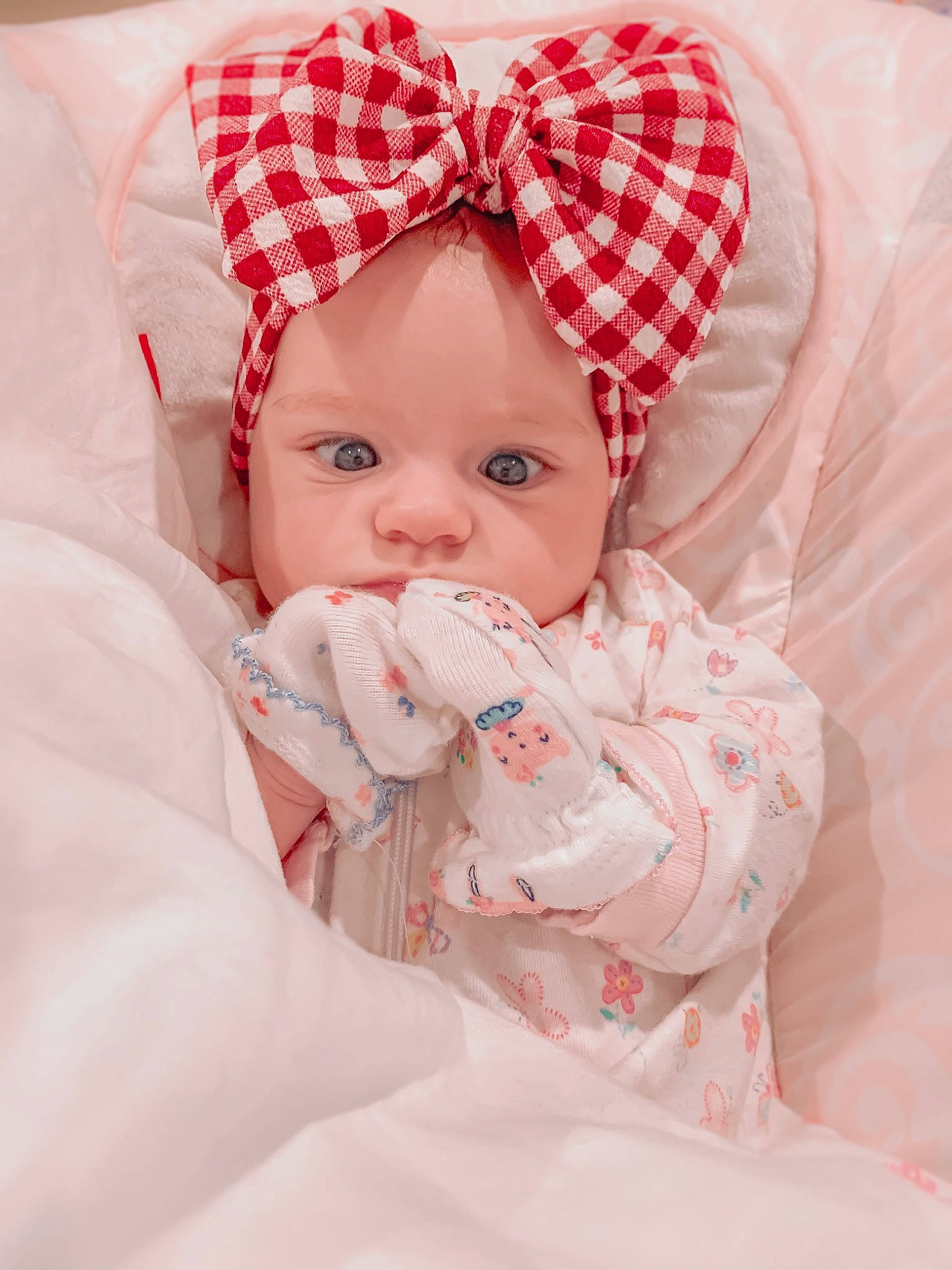 Hallie is registered to the contest to win money with this photo: baby, cheek, child, eye, face, head, headwear, lip, nose, person, pink, product, skin, smile, textile, toddler