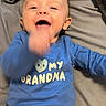 Maverick joined the competition — help win amazing prizes! baby, blanket, blue_shirt, bright_colors, casual, child, clothing, cute, expression, face, hand_motion, happy, indoors, infant, joyful, laying_down, person, smiling, toddler, yellow_pants
