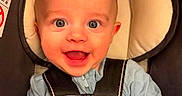 Maverick is registered to the contest to win money with this photo: baby, baby_boy, baby_girl, blue_clothing, car_seat, child, closeup, cute, happy, head_support, indoor, infant, mittens, newborn, person, portrait, safety_harness, seatbelt, smiling, young_child