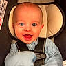 baby, baby_boy, baby_girl, blue_clothing, car_seat, child, closeup, cute, happy, head_support, indoor, infant, mittens, newborn, person, portrait, safety_harness, seatbelt, smiling, young_child