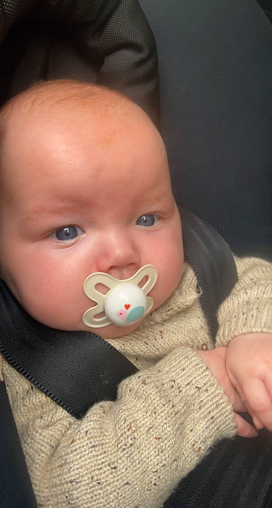 Noah is registered to the contest to win money with this photo: baby, baby_toddler_clothing, cheek, child, close_up, comfort, ear, eyebrow, eyelash, finger, happy, human_body, iris, lip, mouth, nail, nose, person, skin, toddler