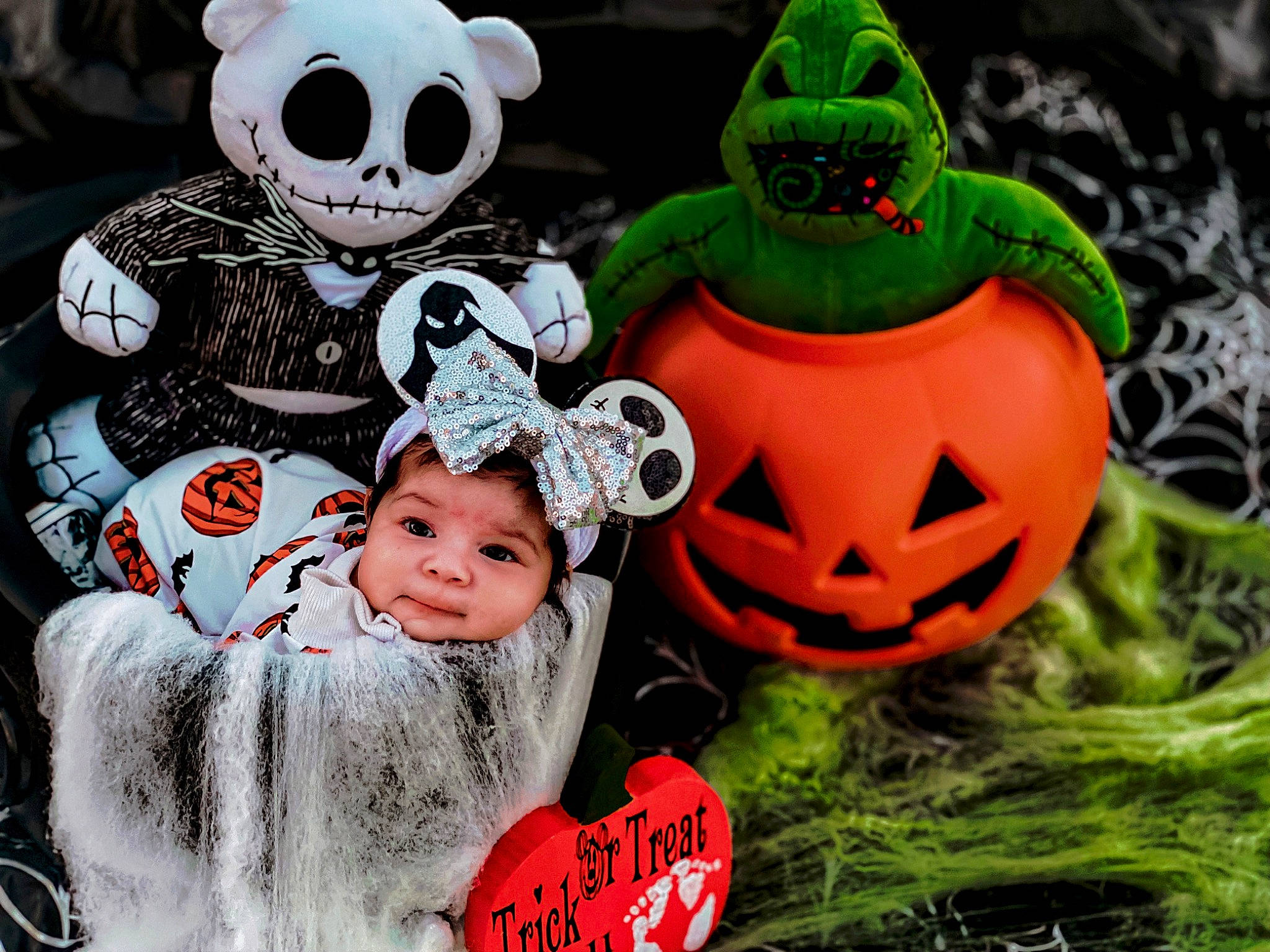 Davina is registered to the contest to win money with this photo: art, calabaza, cucurbita, event, fashion_accessory, fictional_character, font, gourd, grass, happy, headgear, headwear, jack_o_lantern, person, plant, pumpkin, skull, smile, toddler, toy