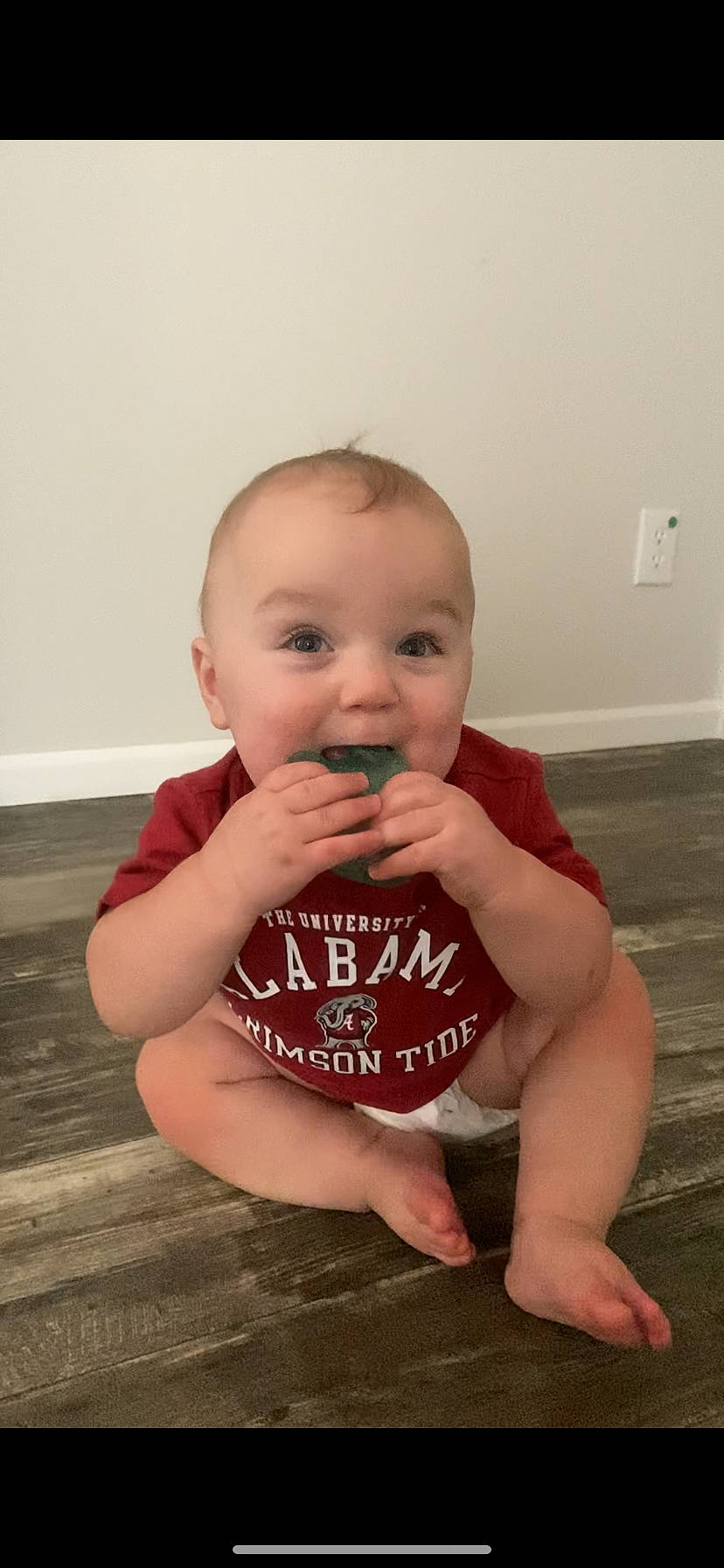 Tyson is registered to the contest to win money with this photo: baby, baby_toddler_clothing, cheek, chin, eye, finger, floor, flooring, gesture, hand, happy, human_body, lip, neck, nose, person, skin, smile, standing, stomach