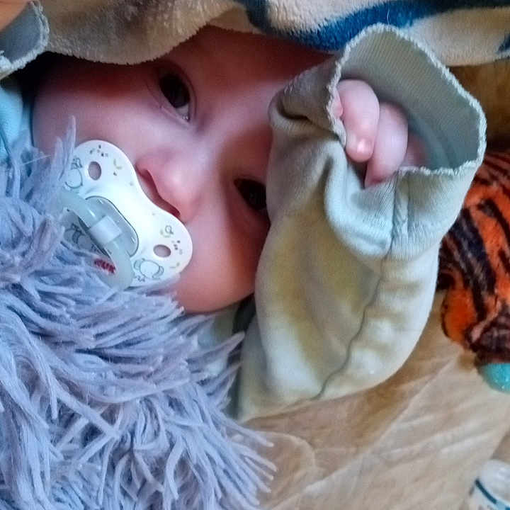 Angel is registered to the contest to win money with this photo: baby, baby_products, baby_sleeping, baby_toddler_clothing, cheek, child, comfort, eye, eyelash, fashion_accessory, fur, grass, head, headgear, iris, linens, skin, textile, toddler, wool