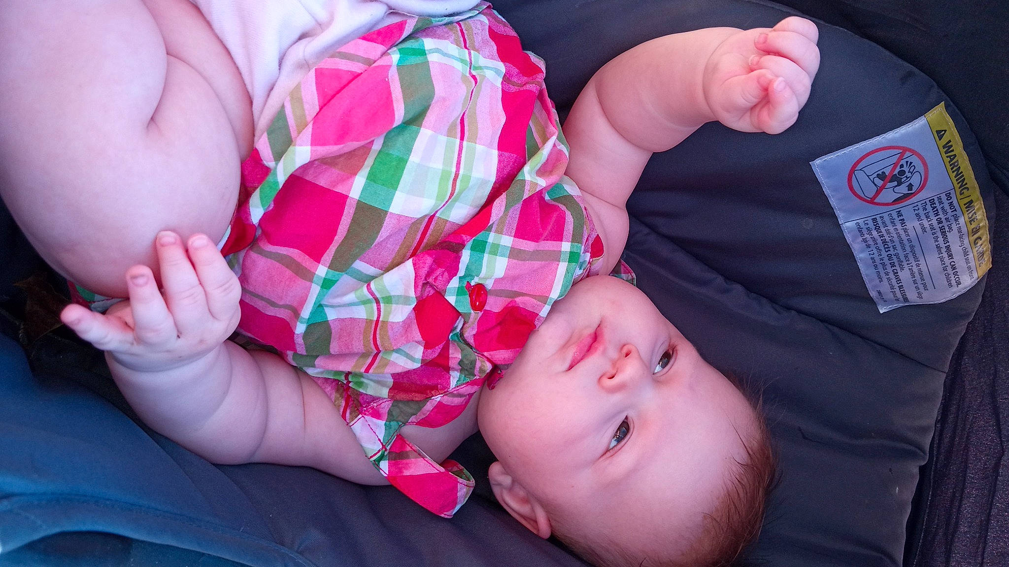 Angel is registered to the contest to win money with this photo: baby, cheek, comfort, eye, facial_expression, finger, gesture, hand, human, human_body, leg, lip, mammal, mouth, nose, organ, person, product, skin, tartan