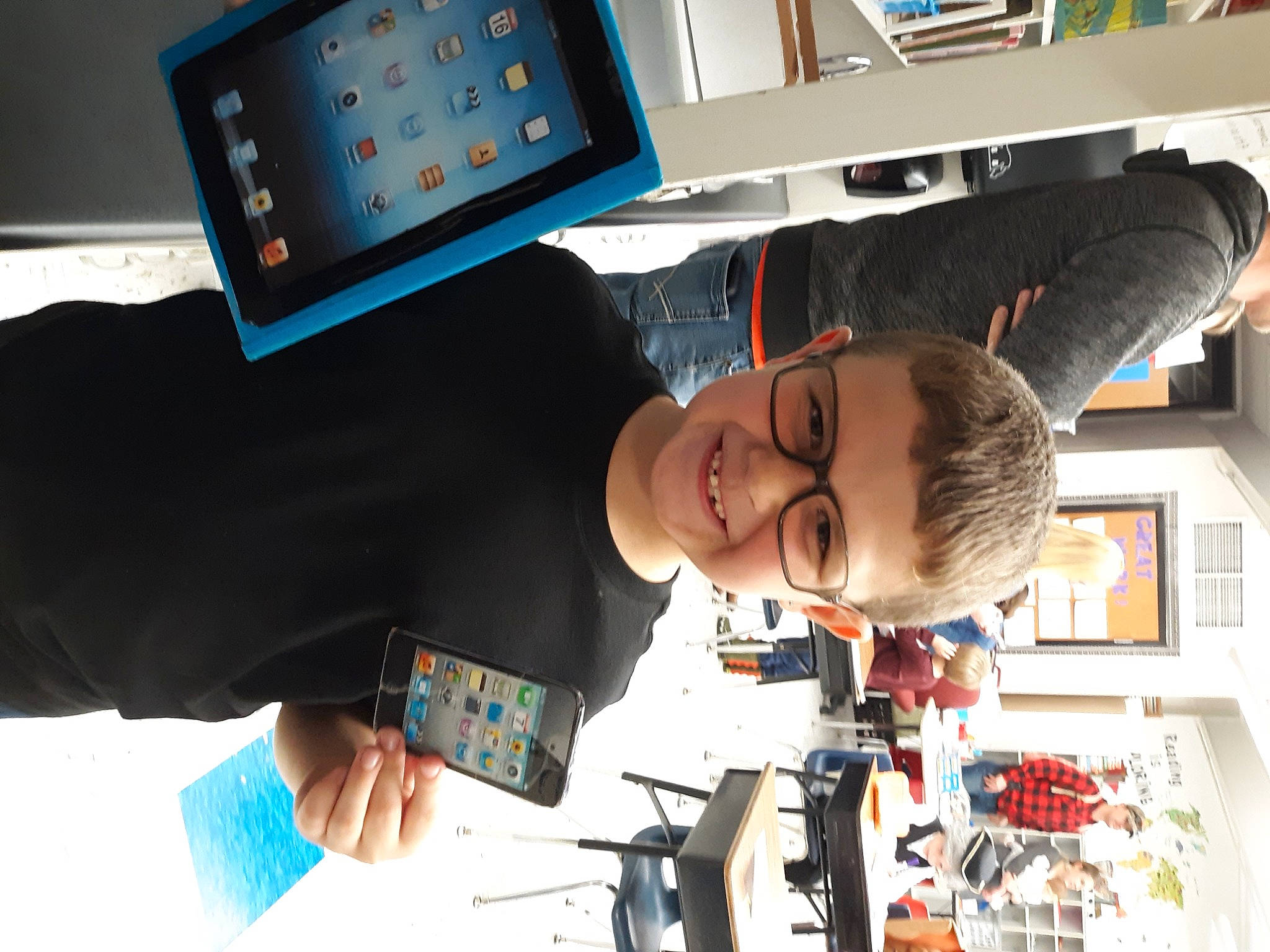 Randy joined the competition — help win amazing prizes! blurred, bookcase, child, communication_device, display_device, engineering, eyewear, fun, gadget, job, joy, machine, multimedia, person, photography, room, shelf, shelving, snapshot, tablet_computer