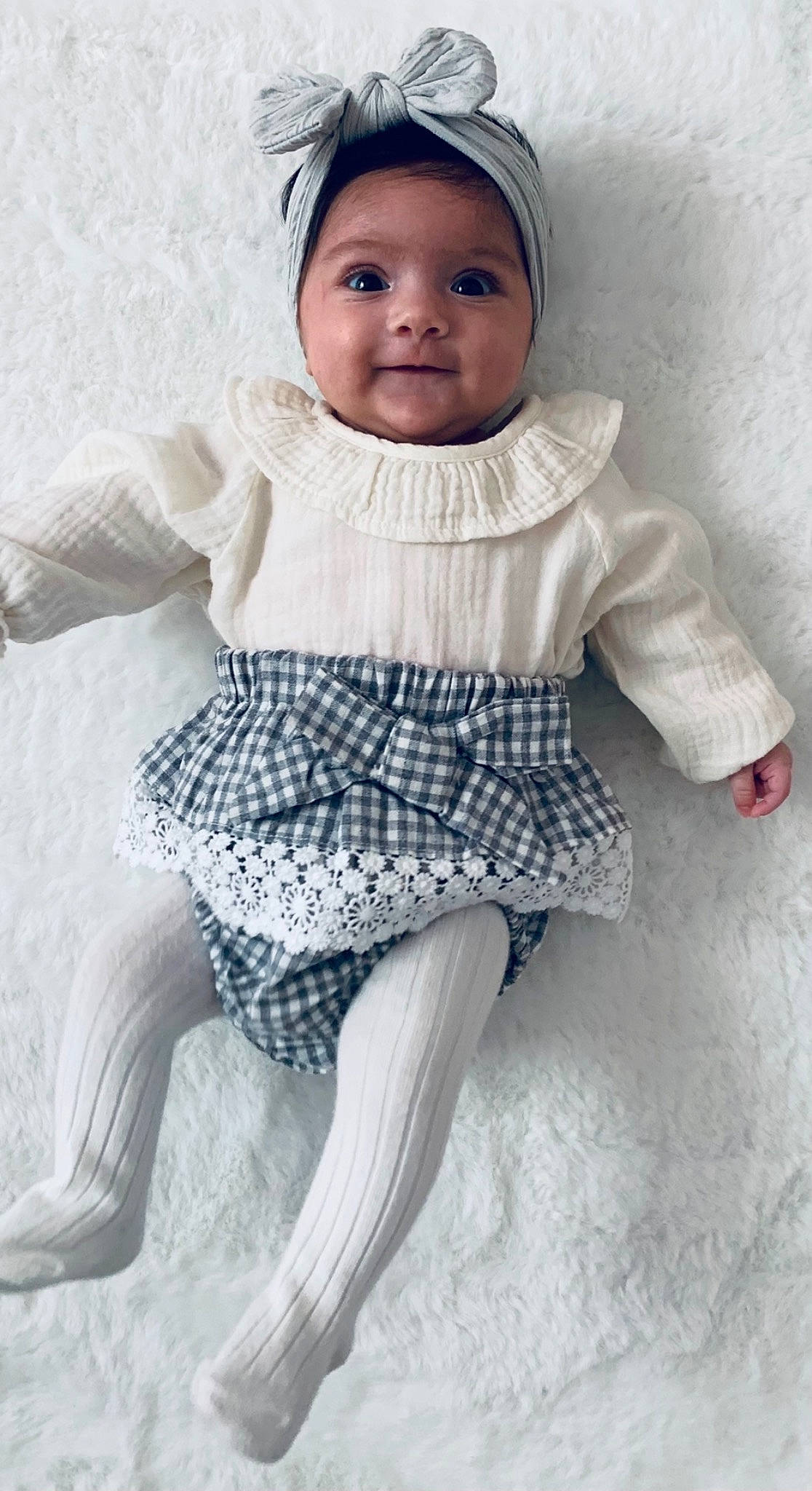 Léina participe au concours pour gagner de l'argent avec cette photo : arm, art, baby, baby_toddler_clothing, cap, collar, eye, face, head, headgear, headwear, human_body, iris, joy, lip, neck, outerwear, person, skin, sleeve