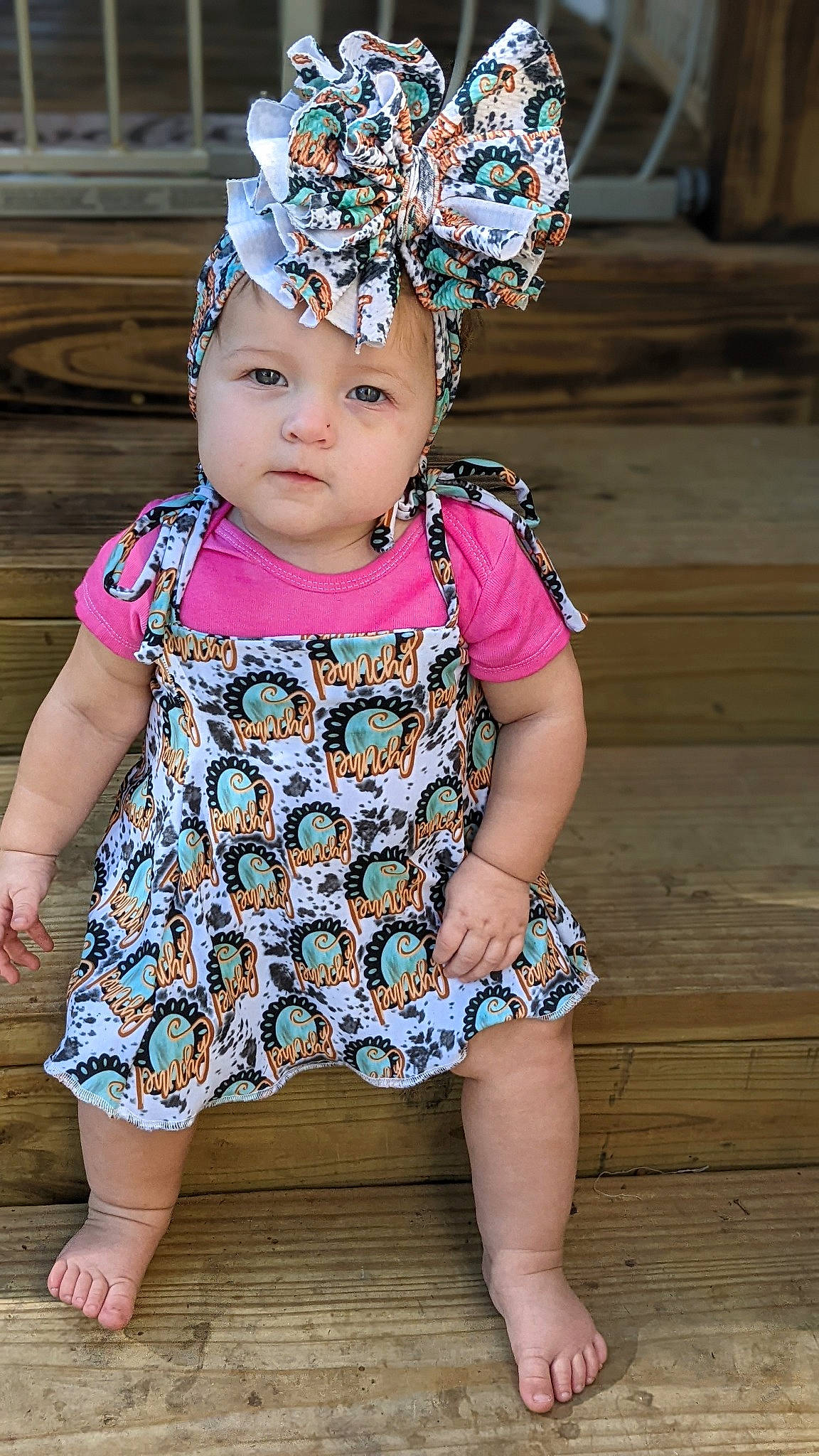 Kaisley joined the competition — help win amazing prizes! baby, baby_toddler_clothing, beauty, child, costume_hat, event, fashion_accessory, fun, happy, headband, headpiece, headwear, jewellery, magenta, pattern, person, pink, purple, sitting, sleeve