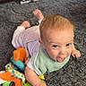 Brady joined the competition — help win amazing prizes! baby, bib, carpet, child, colorful, crawling, cute, floor, fun, happy, home, indoor, infant, person, playful, slippers, soft_toy, tongue_out, toy, vacuum_cleaner