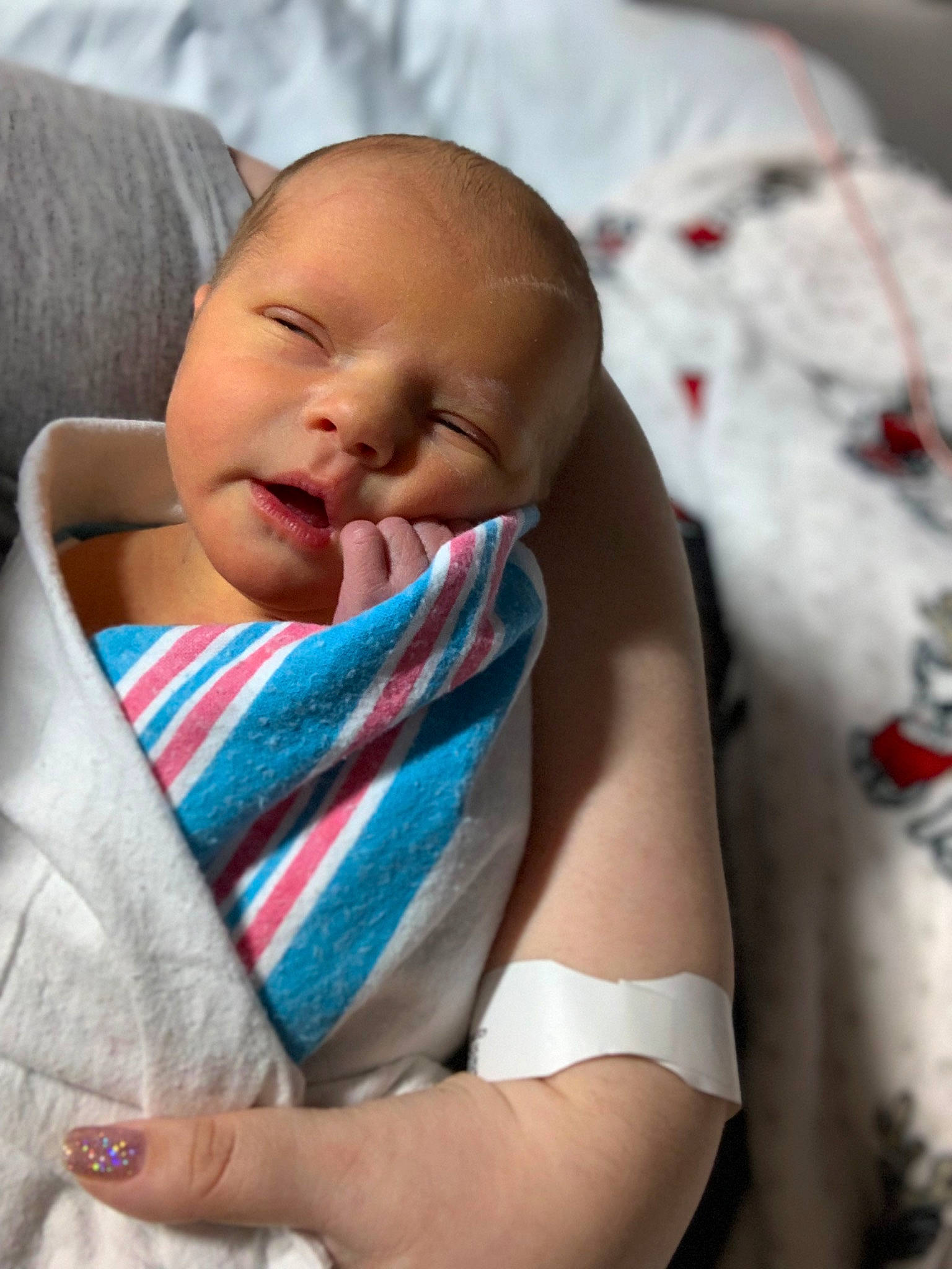 Brynne is registered to the contest to win money with this photo: baby, baby_products, baby_toddler_clothing, cheek, child, chin, comfort, eyebrow, facial_expression, finger, happy, iris, linens, lip, mouth, nose, person, skin, sleeve, textile