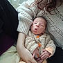 Sohan participe au concours pour gagner de l'argent avec cette photo : baby, newborn, infant, parent_arm, knitted_sweater, orange_buttons, hospital_bed, blanket, hand, fingers, hair, cozy, portrait, holding, cuddle, clothing, resting, closeup, skin, cradling