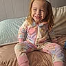 Delilah is registered to the contest to win money with this photo: bed, bedroom, blanket, child, cozy, furniture, girl, happy, headband, indoor, laughing, long_hair, pajamas, pastel, photography, pillow, portrait, seated, smiling, sparkles