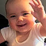 Oaklynn joined the competition — help win amazing prizes! baby, child, smiling, waving, onesie, cute, face, happy, infant, portrait, skin, cheeks, hand, expression, young, person, sitting, indoors, head, human