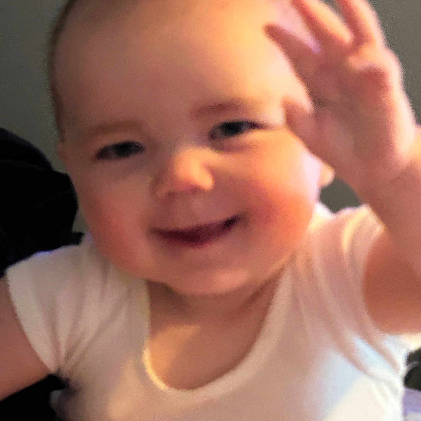 Oaklynn joined the competition — help win amazing prizes! baby, cheeks, child, cute, expression, face, hand, happy, head, human, indoors, infant, onesie, person, portrait, sitting, skin, smiling, waving, young