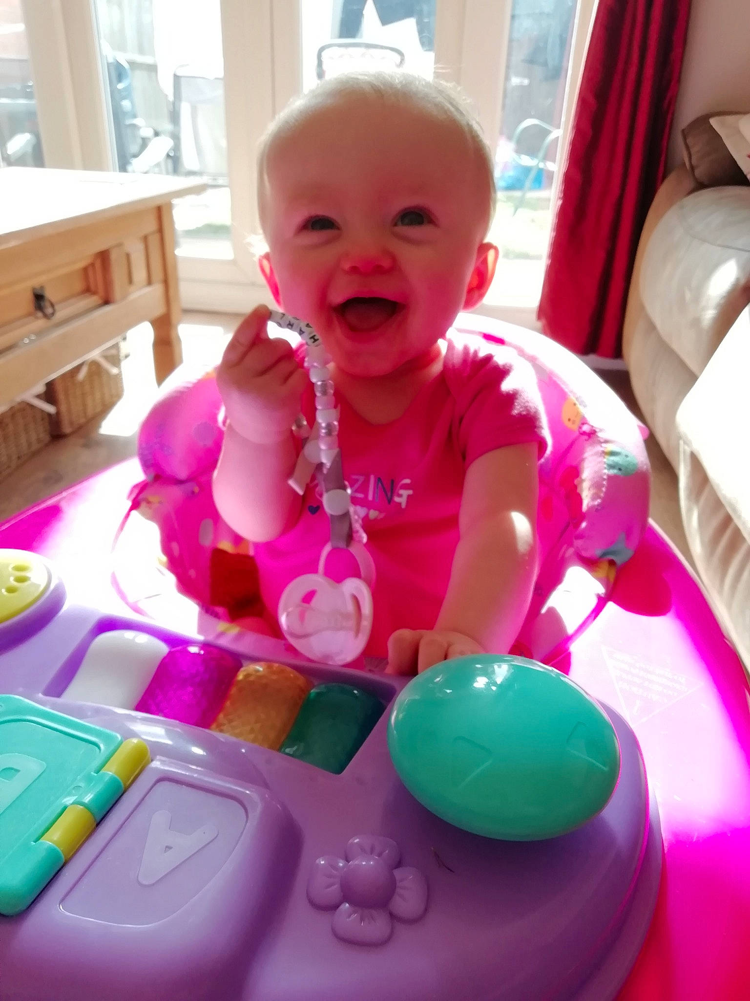 Harlie is registered to the contest to win money with this photo: baby, child, electronic_device, fun, magenta, person, pink, play, playset, product, skin, smile, toddler, toy