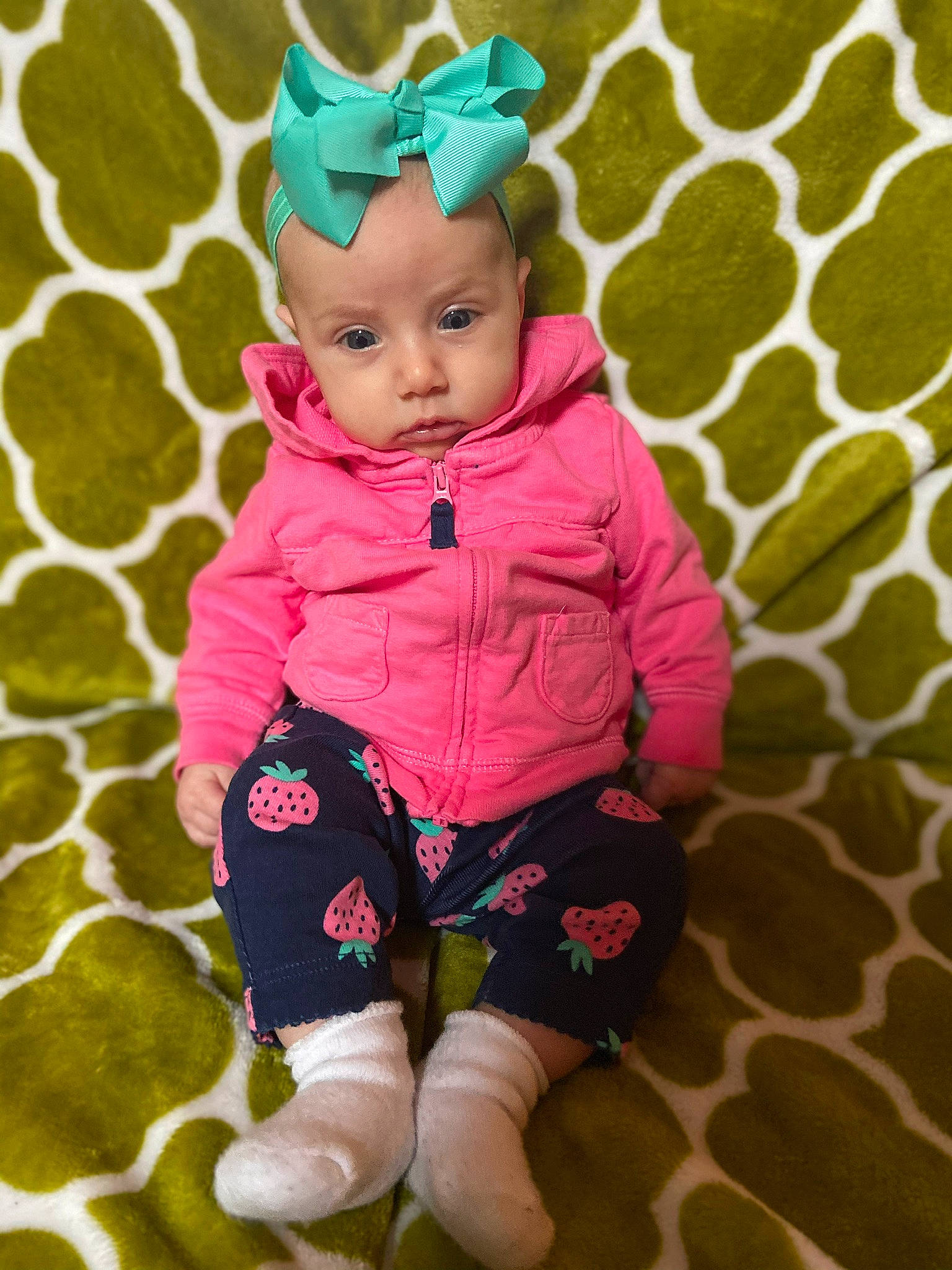 Ella joined the competition — help win amazing prizes! baby, baby_products, baby_toddler_clothing, child, ear, fictional_character, green, happy, head, headwear, magenta, pattern, person, photography, pink, plant, play, product, sleeve, toddler