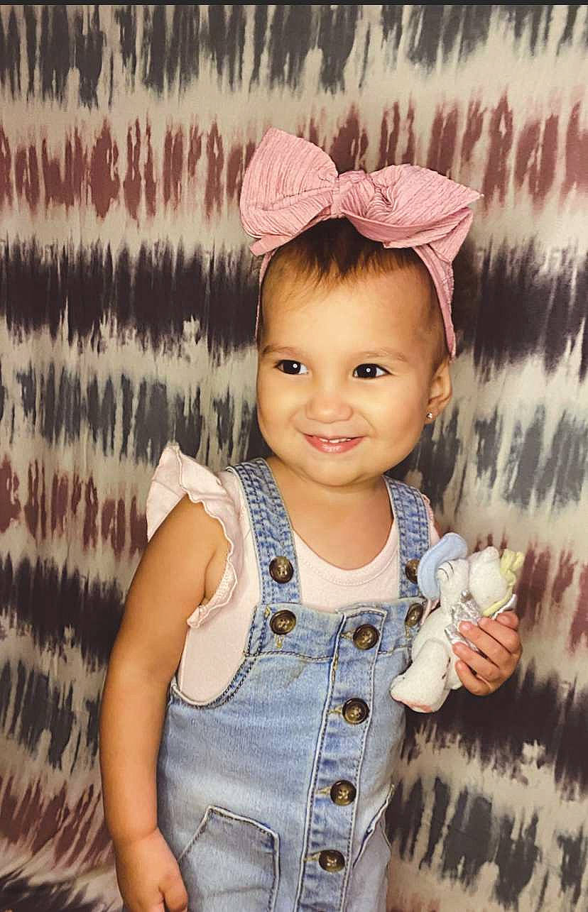 Ivory is registered to the contest to win money with this photo: arm, baby_toddler_clothing, chin, eye, eyelash, face, facial_expression, fashion, gesture, hairstyle, happy, head, human, joy, neck, organ, person, skin, sleeve, smile