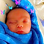 John is registered to the contest to win money with this photo: aqua, azure, baby, baby_sleeping, baby_toddler_clothing, blue, cheek, child, chin, cool, electric_blue, eyebrow, face, facial_expression, headgear, pink, product, purple, skin, toddler