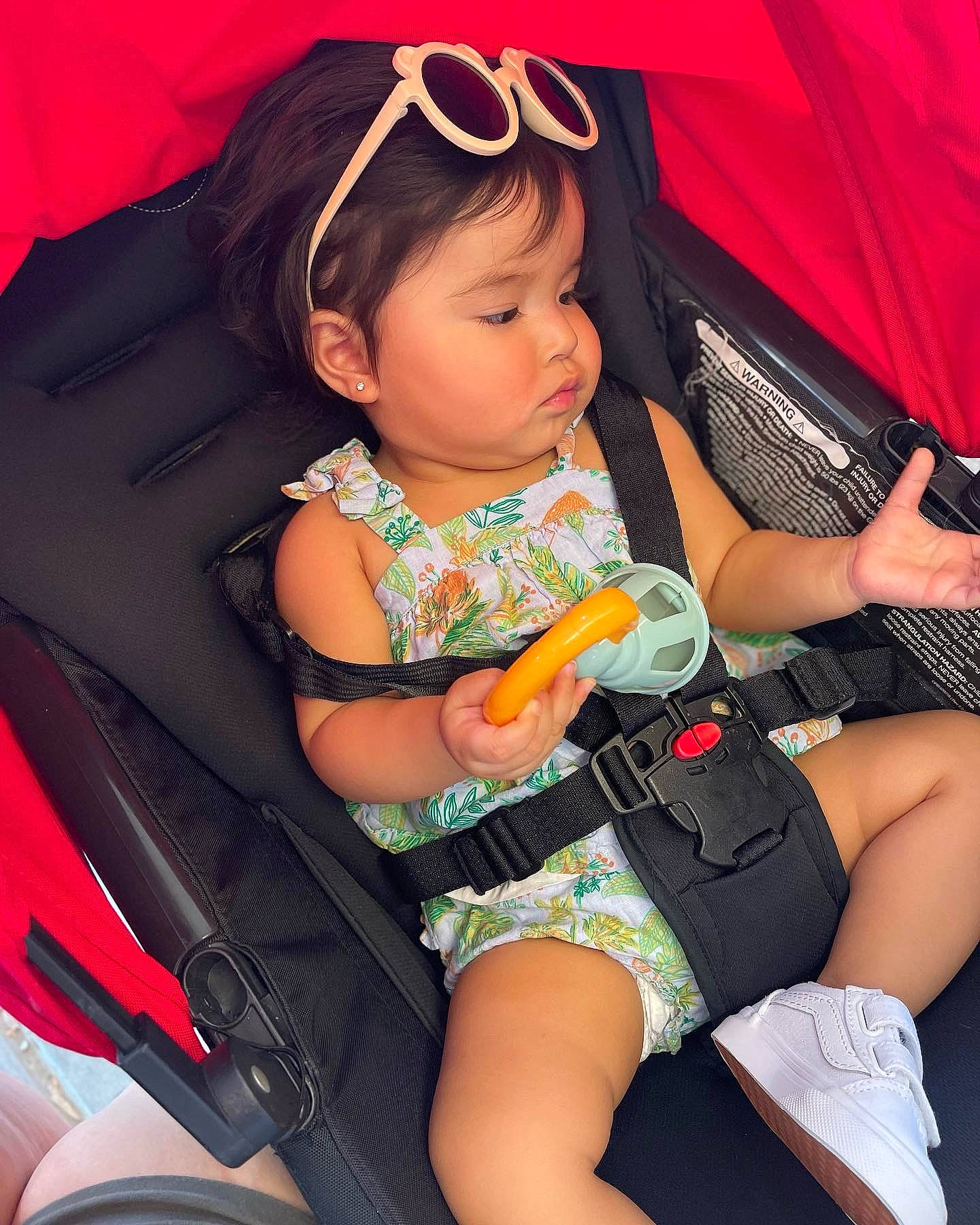 Camilla joined the competition — help win amazing prizes! baby_carriage, baby_toddler_clothing, black_hair, comfort, cool, facial_expression, finger, fun, hairstyle, human_body, knee, lap, leg, mouth, nail, organ, person, pink, skin, thigh