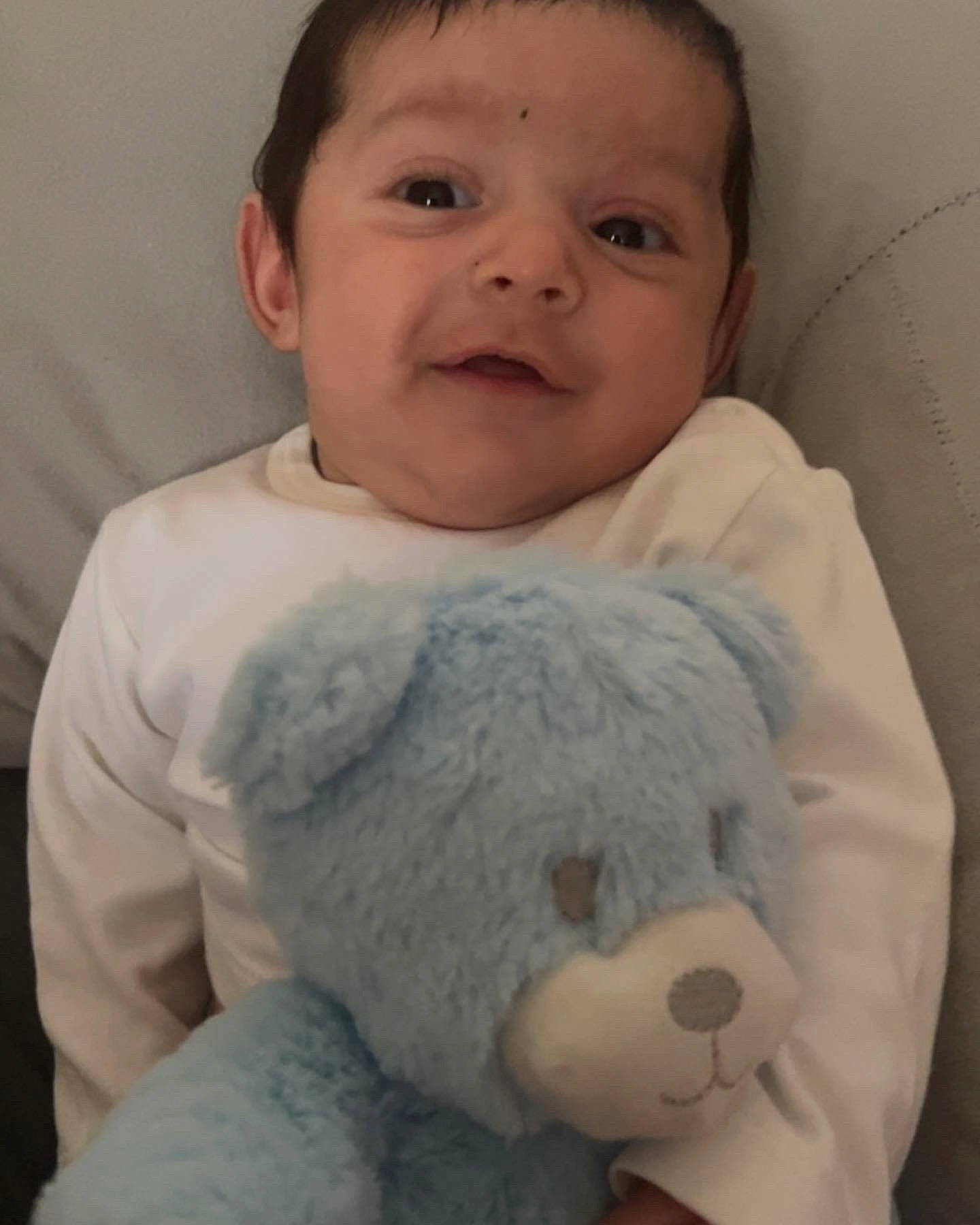 Nico is registered to the contest to win money with this photo: arm, baby, baby_sleeping, baby_toddler_clothing, cheek, comfort, eye, eyelash, gesture, happy, head, mouth, nose, person, skin, sleeve, smile, textile, toddler, toy