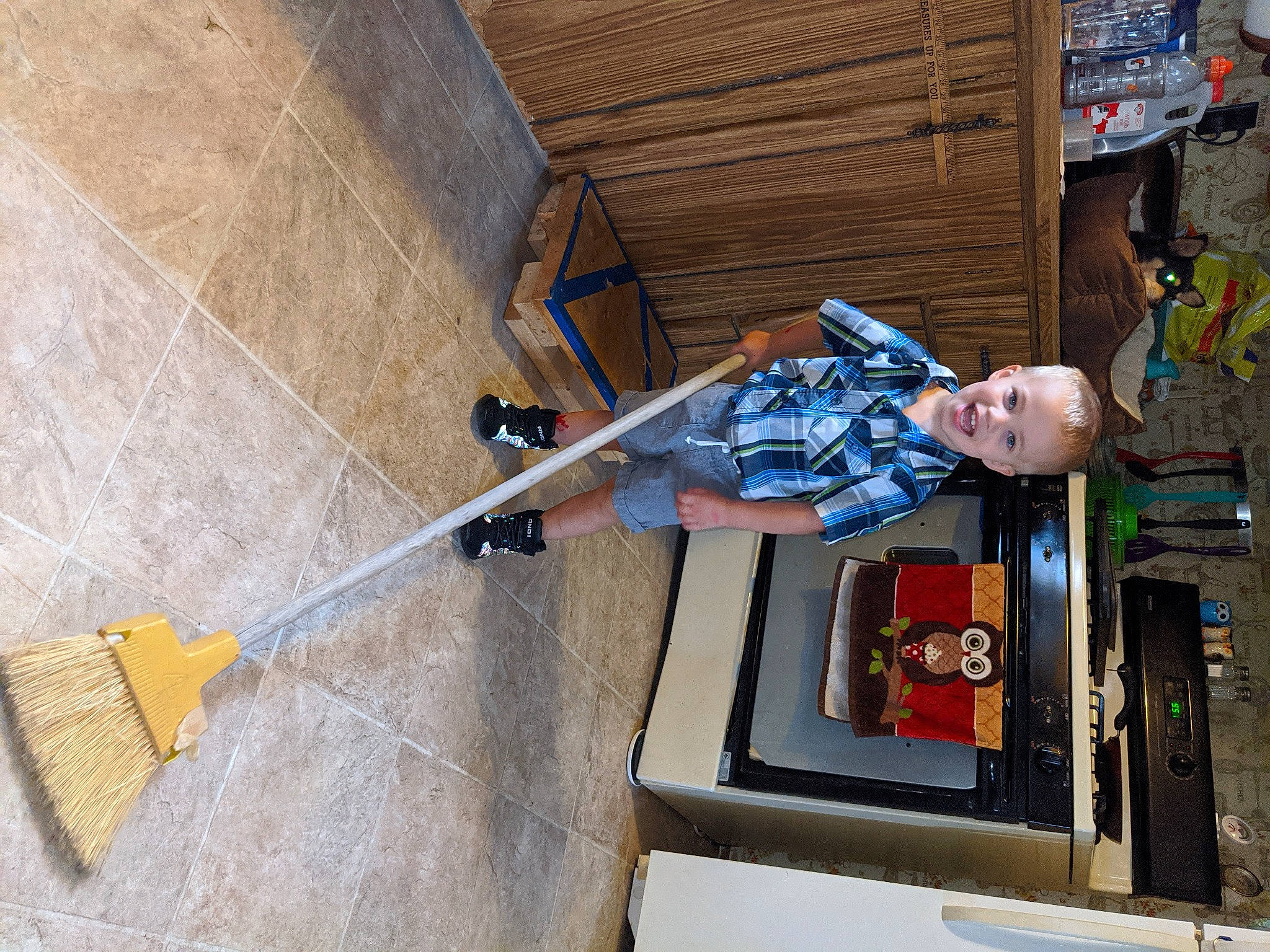 Carson is registered to the contest to win money with this photo: automotive_exterior, concrete, door, facade, flooring, handrail, hardwood, hat, joy, leisure, machine, metal, outdoor_shoe, person, recreation, smile, stairs, toddler, walking_shoe, wood