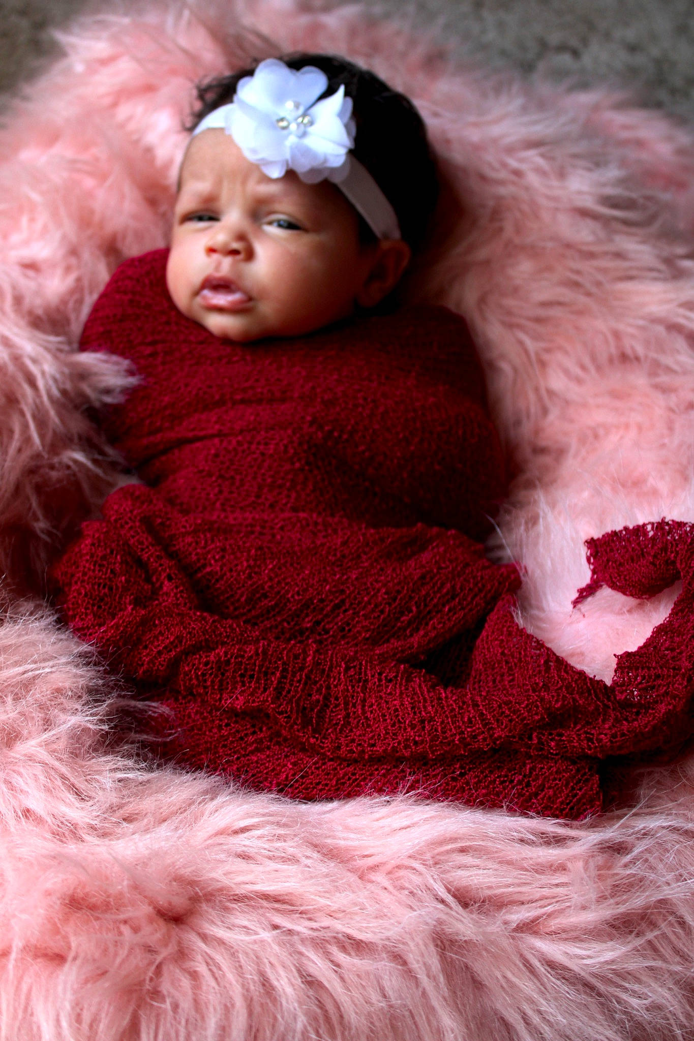 Novalee is registered to the contest to win money with this photo: baby, child, costume, fur, fur_clothing, hair_accessory, headgear, headwear, knitting, outerwear, person, photography, pink, red, textile, toddler, wool