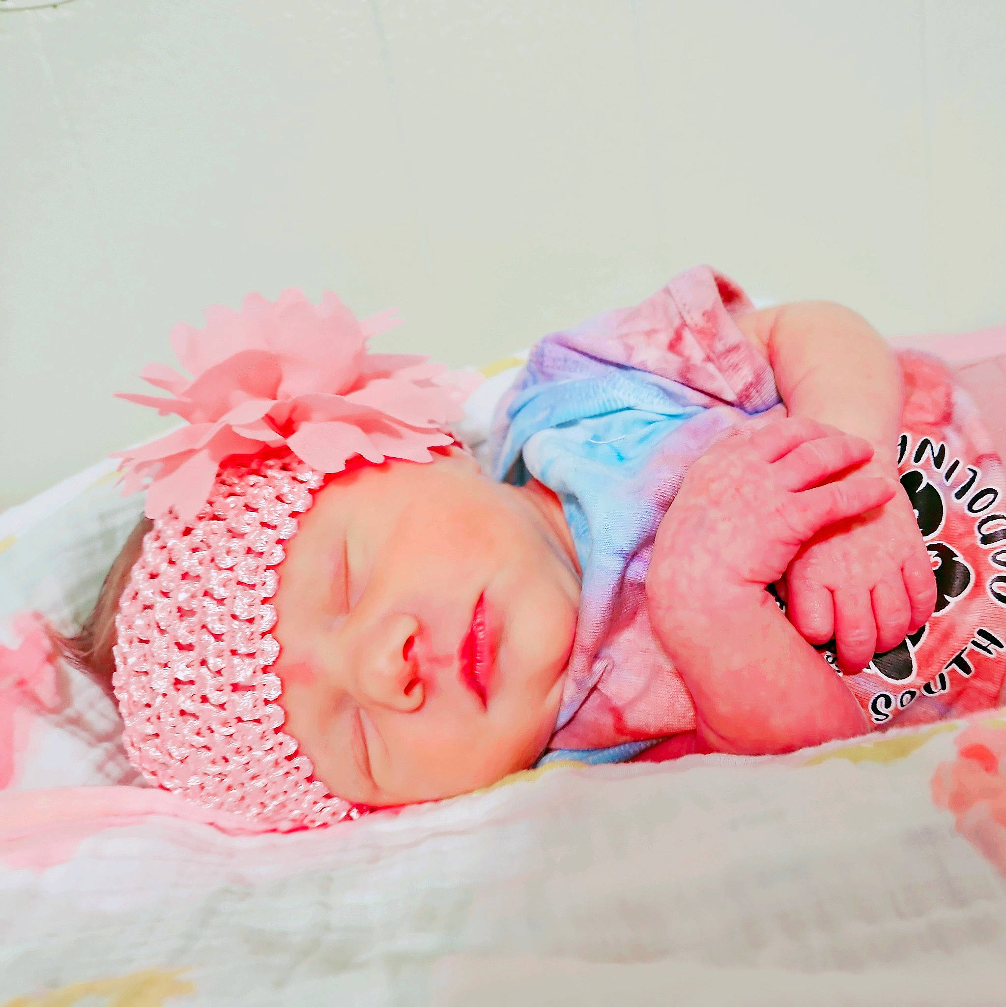 Winter is registered to the contest to win money with this photo: arm, baby, baby_sleeping, baby_toddler_clothing, bedtime, child, comfort, fashion_accessory, hair_accessory, happy, headband, headgear, headwear, linens, magenta, nap, pattern, person, pink, skin