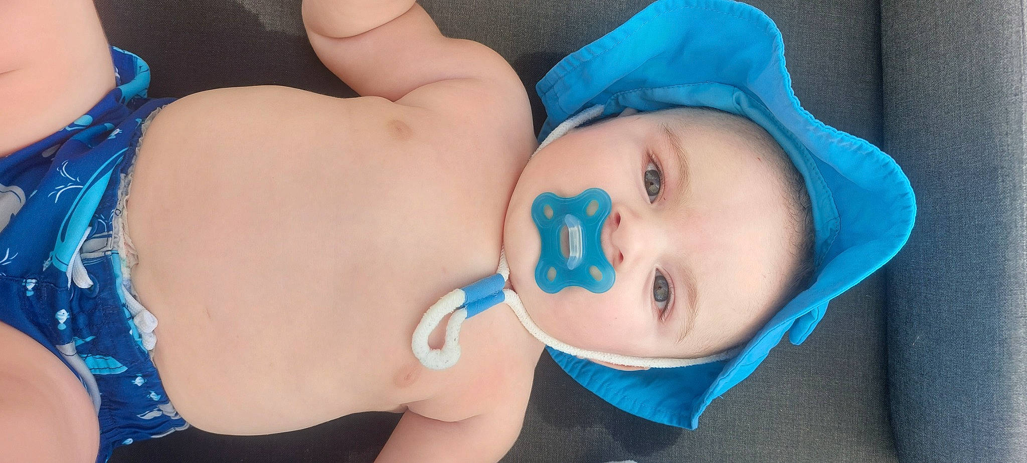 Joseph is registered to the contest to win money with this photo: baby, cheek, chin, cool, eyebrow, eyelash, face, facial_expression, gesture, hand, head, human_body, iris, lip, mouth, neck, nose, person, product, skin