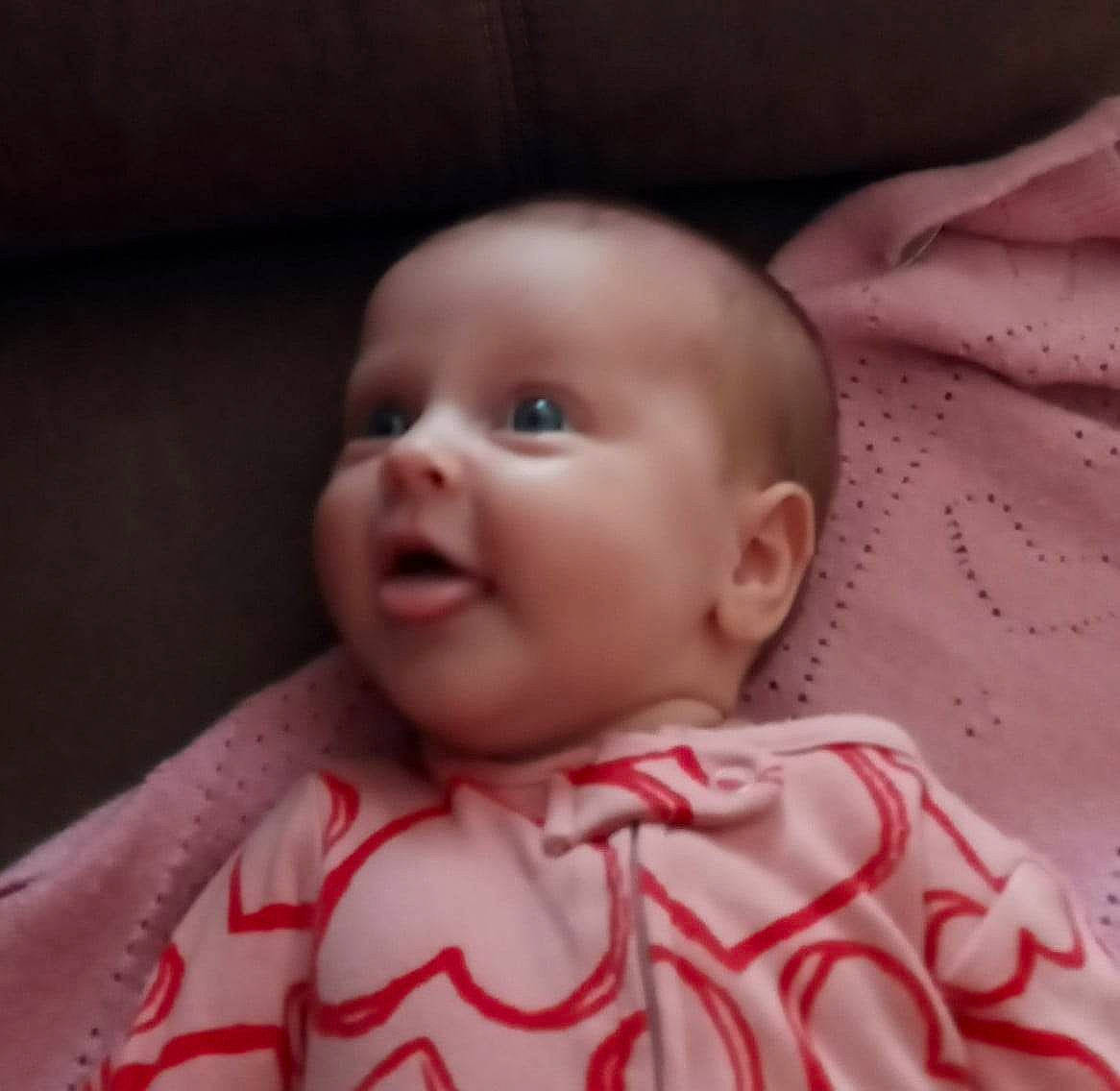 Chloee is registered to the contest to win money with this photo: baby, baby_toddler_clothing, carmine, cheek, child, collar, comfort, ear, flesh, happy, iris, laugh, linens, magenta, pattern, person, pink, sitting, sleeve, smile