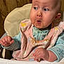 baby, bib, child, clothing, curious, cute, expression, face, hand, head, high_chair, indoor, infant, pajamas, person, seat, skin, surprised, wooden_door, young