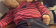 Omar is registered to the contest to win money with this photo: baby, bed, bodypart, clothing, couch, cushion, face, finger, furniture, hand, head, homedecor, jeans, pants, person, photography, portrait, sleeping, teddybear, toy