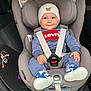baby, beanie, blue_clothing, car_interior, car_seat, cheeks, child, cozy, cute, eyes, hands, hat, infant, levi_logo, person, portrait, safety, seat_belt, smile, sneakers