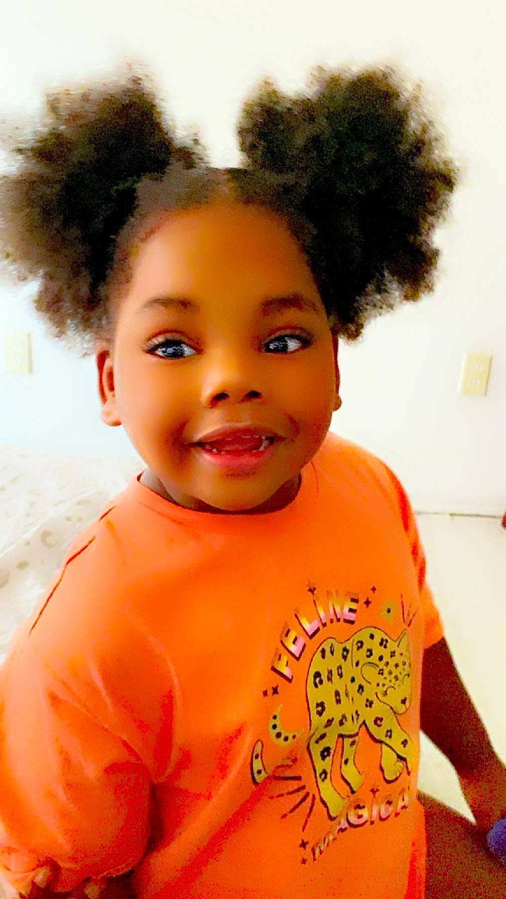 Aliyah joined the competition — help win amazing prizes! afro, black_hair, cheek, cool, ear, eyebrow, eyelash, forehead, fun, hair, happy, head, headgear, iris, joy, lip, lipstick, nose, orange, person