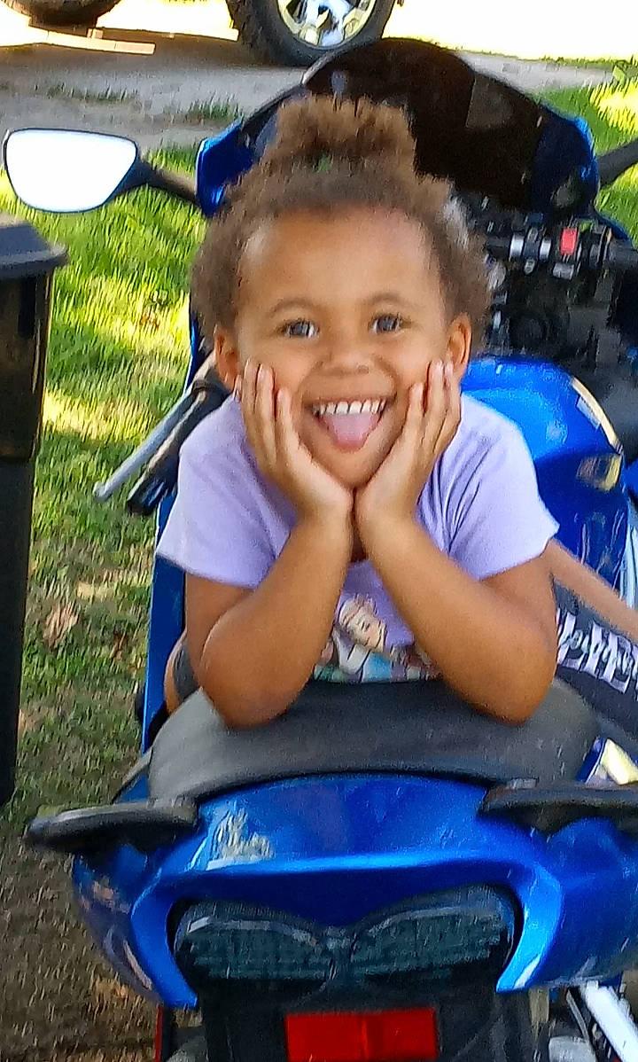 Laina joined the competition — help win amazing prizes! automotive_design, automotive_exterior, automotive_tire, blue, bumper, child, cool, electric_blue, face, fun, happy, hood, joy, leisure, light, motor_vehicle, person, recreation, smile, t_shirt