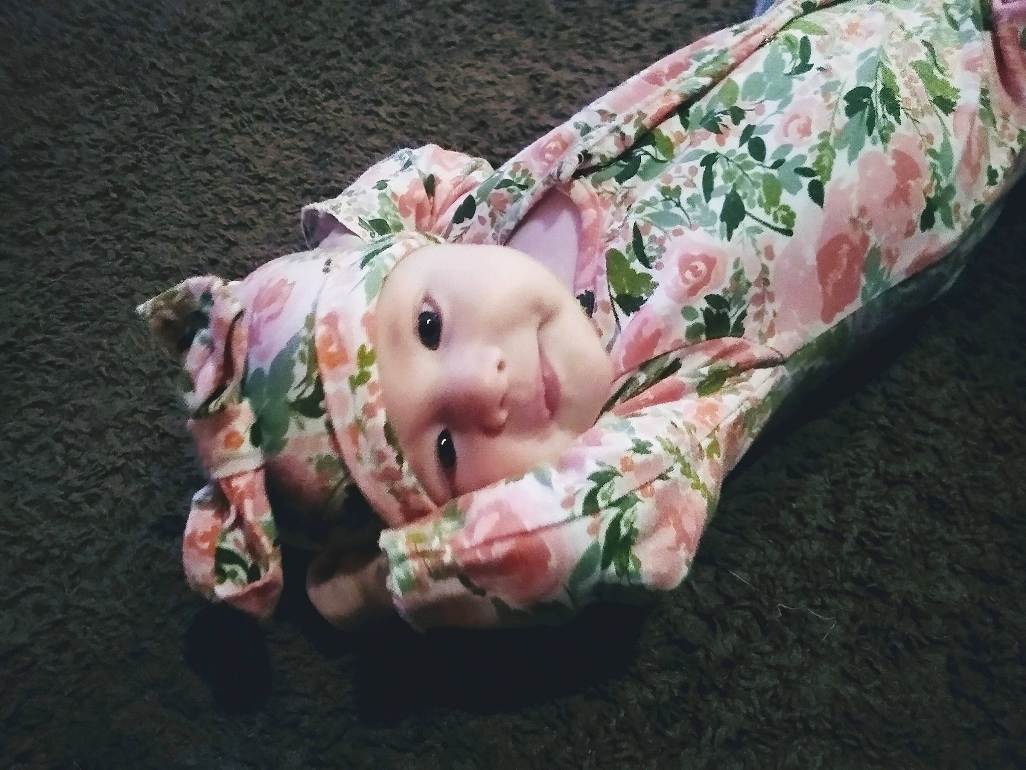 Meadow is registered to the contest to win money with this photo: baby, baby_toddler_clothing, baby_toys, camouflage, doll, headwear, person, pink, toy