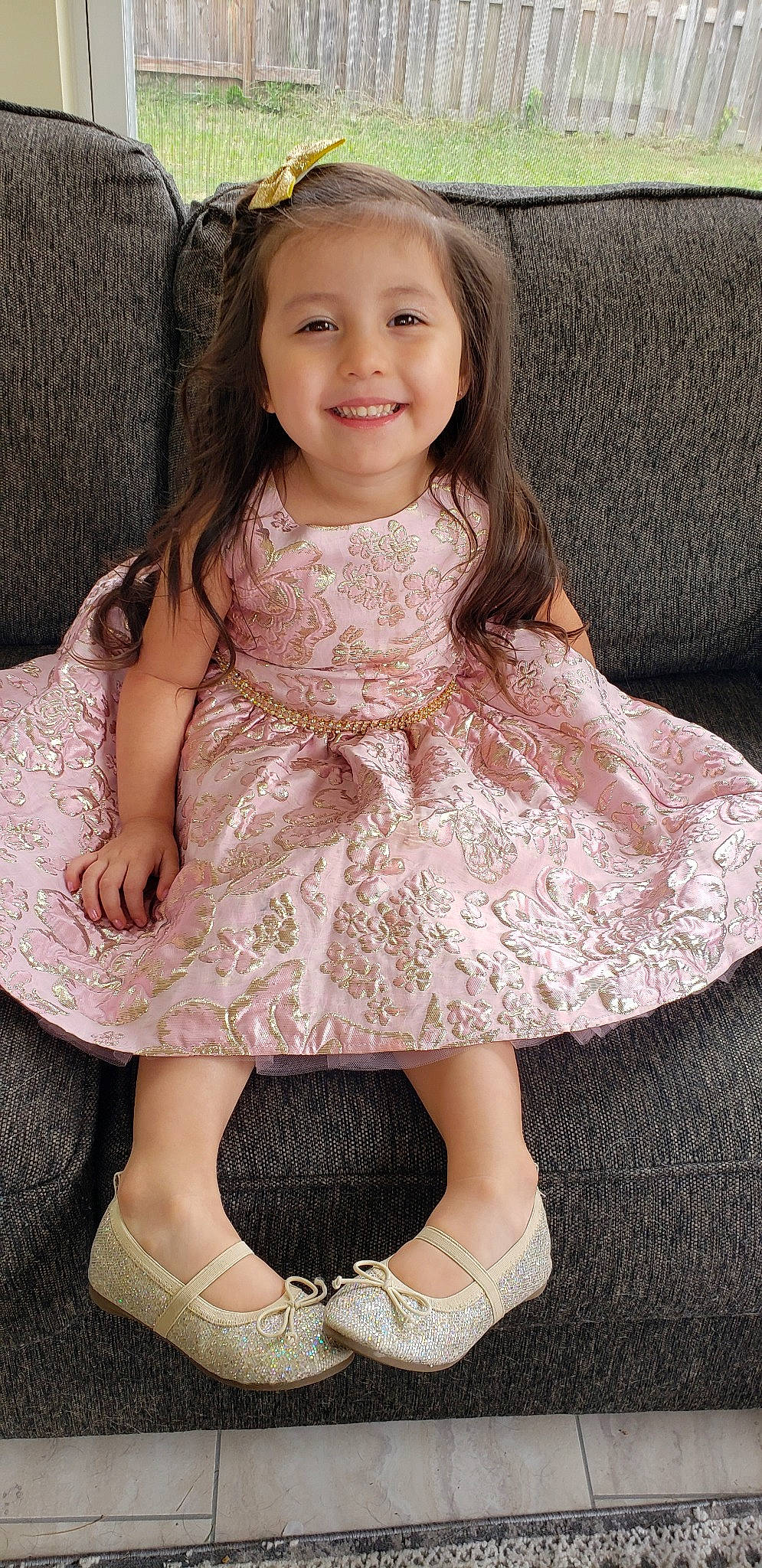 Mia is registered to the contest to win money with this photo: baby_toddler_clothing, beige, brown_hair, child, child_model, clothing, dress, joy, lace, pattern, person, pink, sitting, smile, toddler
