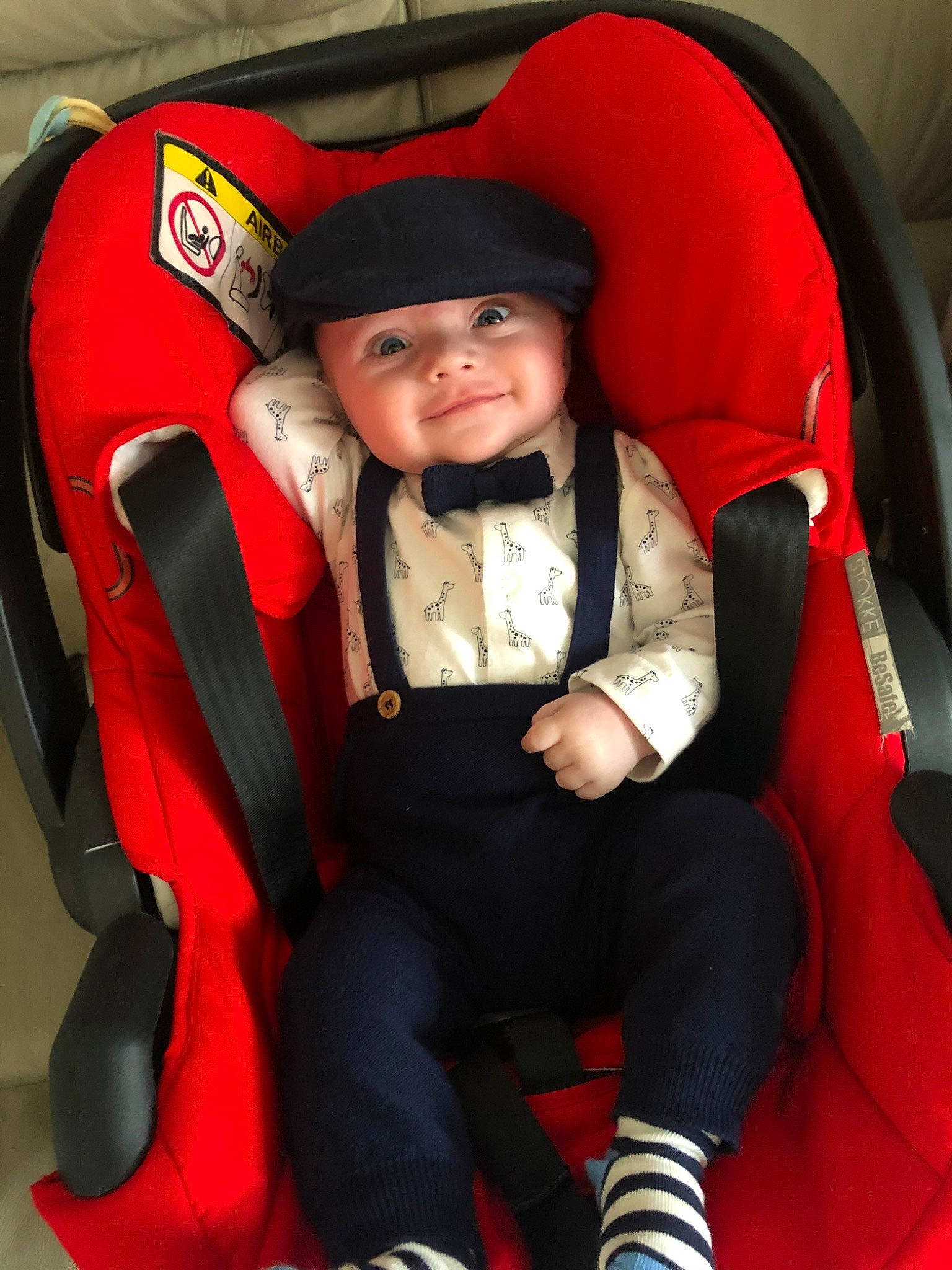 Alfred joined the competition — help win amazing prizes! baby_carriage, baby_in_car_seat, baby_products, car_seat, child, fun, headwear, joy, person, red, smile, toddler